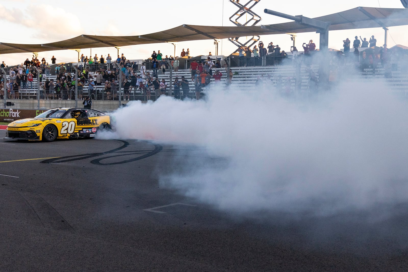 Christopher Bell celebrates his win during a NASCAR Cup Series auto race at Circuit of the Americas in Austin, Texas, Sunday, March 2, 2025. (AP Photo/Stephen Spillman)