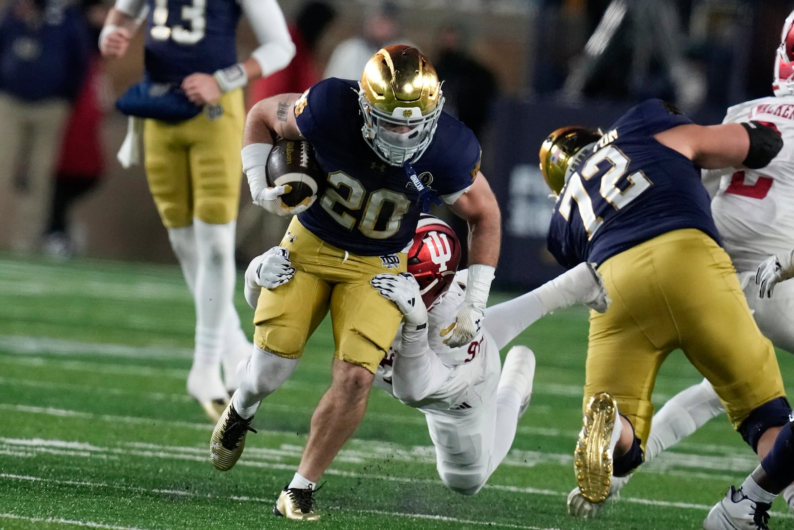 Notre Dame running back Aneyas Williams (20) runs the ball against Indiana during the second half in the first round of the NCAA College Football Playoff, Friday, Dec. 20, 2024, in South Bend, Ind. (AP Photo/Darron Cummings)