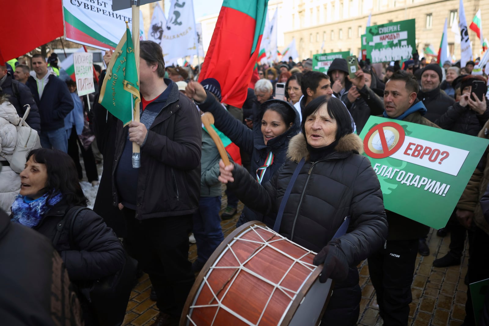 Protesters shout anti-government slogans during nationalist protests demanding the government to scrap plans to take the country into the eurozone, Sofia, Saturday, Feb. 22, 2025. (AP Photo/Valentina Petrova)