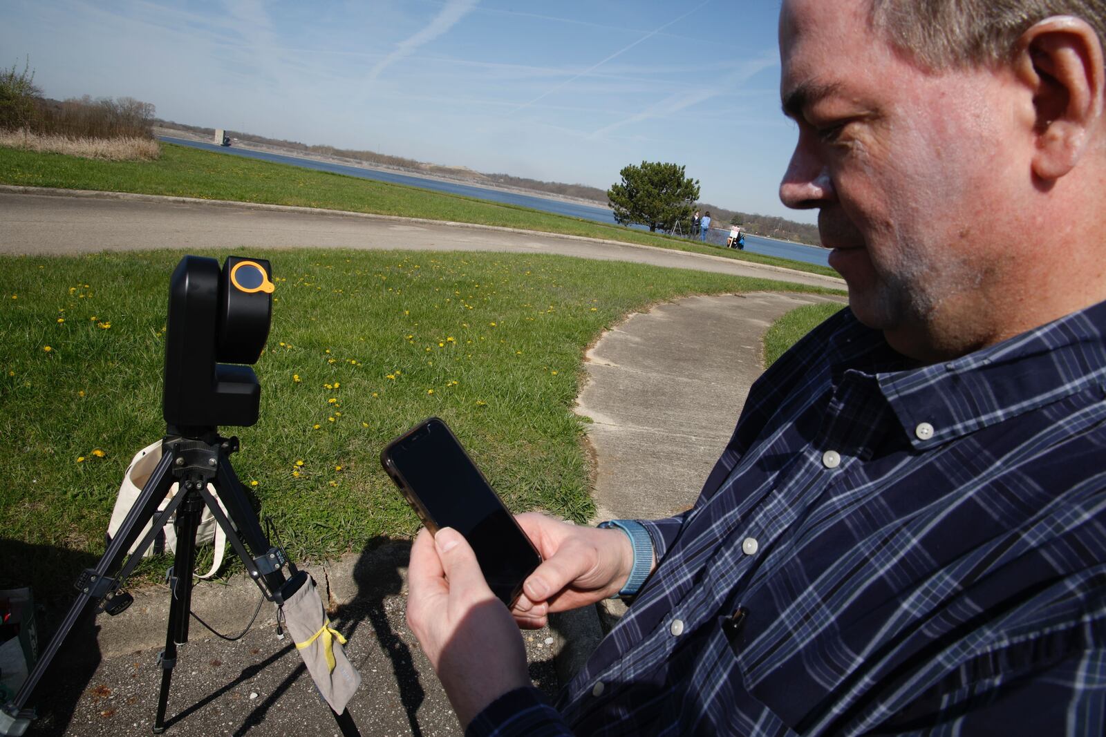 Creig Donnald, from Maryland, sets up his specialized camera to view Monday’s eclipse at Buck Creek State Park in Clark County. BILL LACKEY/STAFF