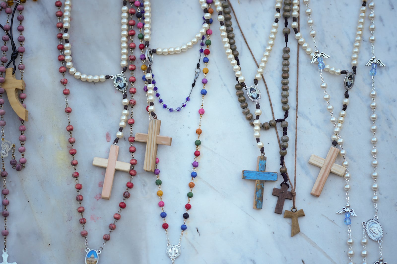 Rosaries for Pope Francis are seen in front of the Agostino Gemelli Polyclinic, in Rome, Tuesday, March 11, 2025, where the Pontiff is hospitalized since Friday, Feb. 14. (AP Photo/Andrew Medichini)