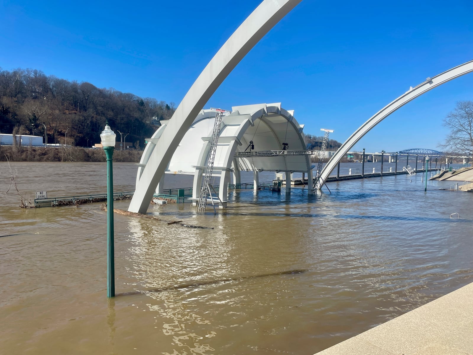 A flooded concert amphitheater along the Kanawha River is shown Friday, Feb. 7, 2025 in Charleston, W.Va. (AP Photo/John Raby)