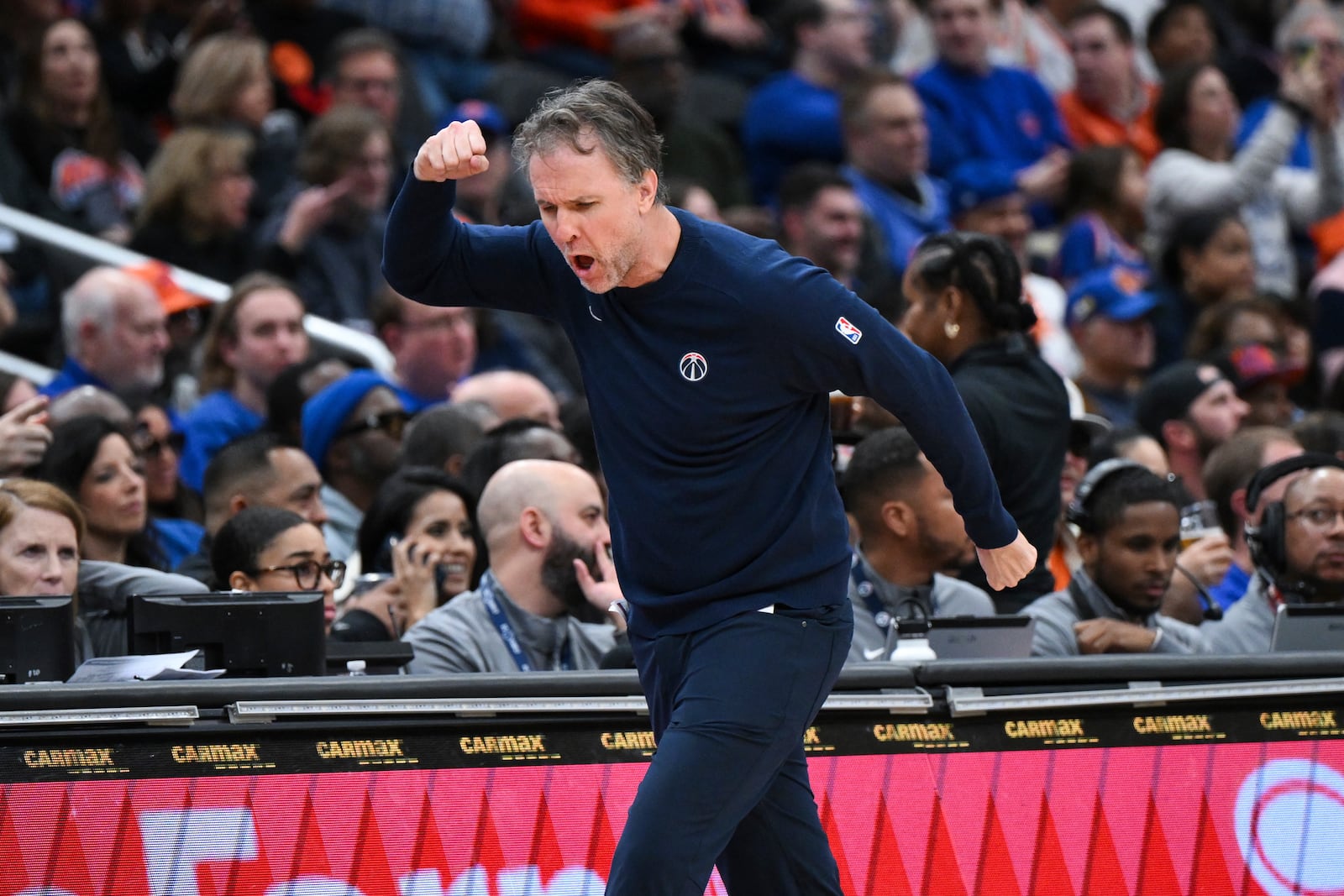 Washington Wizards head coach Brian Keefe reacts to a foul called against his team during the first half of an NBA basketball game against the New York Knicks, Saturday, Dec. 28, 2024, in Washington. (AP Photo/Terrance Williams)