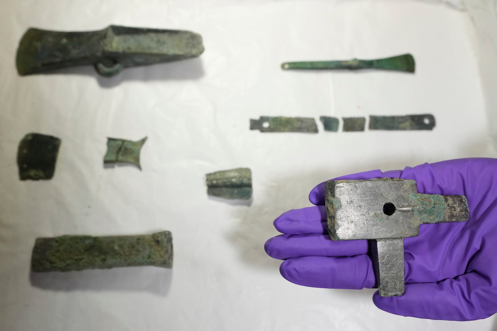 A hoard of Bronze Age metalworker's tools from around 3,300 years ago, is displayed at the British Museum's annual treasure launch in London, Tuesday, Feb. 11, 2025. (AP Photo/Kirsty Wigglesworth)