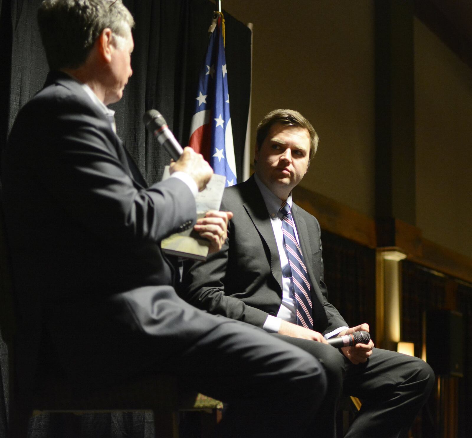 Middletown native and “Hillbilly Elegy” author J.D. Vance listens to a question from 700 WLW radio personality Bill Cunningham on Saturday evening, March 11, 2017, at the Butler County GOP Lincoln Day Dinner at the Oscar Event Center in Fairfield. MICHAEL D. PITMAN/STAFF