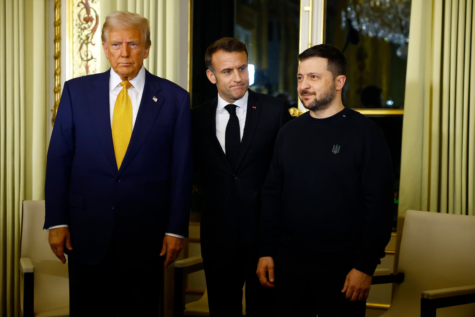 FILE - U.S. President-elect Donald Trump, French President Emmanuel Macron, center, and Ukraine's President Volodymyr Zelenskyy pose before a meeting at the Élysée Palace in Paris, Dec. 7, 2024. (Sarah Meyssonnier/Pool via AP, File)