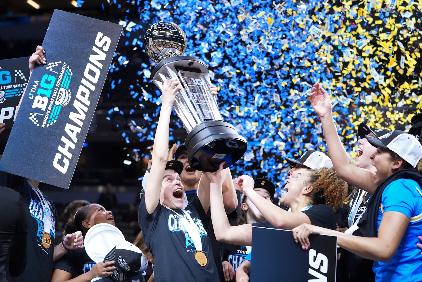 UCLA players celebrate after an NCAA college basketball game against Southern California in the championship of the Big Ten Conference tournament in Indianapolis, Sunday, March 9, 2025. (AP Photo/Michael Conroy)