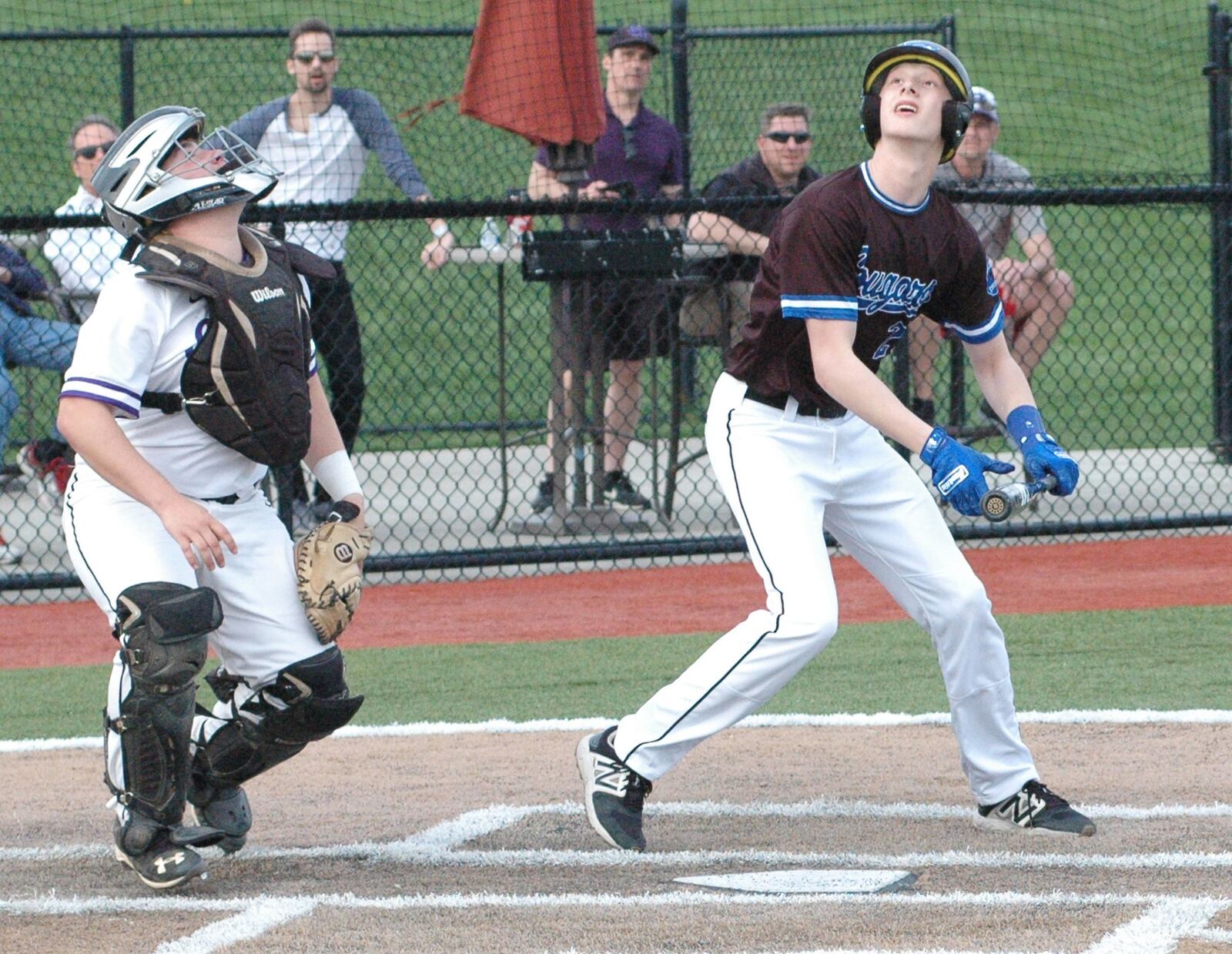 Cincinnati Christian’s Cody Anderson and Cincinnati Hills Christian Academy catcher Oakley Tippen watch a popped-up bunt attempt Thursday during a Miami Valley Conference baseball game at Prasco Park’s Legacy Field in Mason. CHCA won 3-2. RICK CASSANO/STAFF