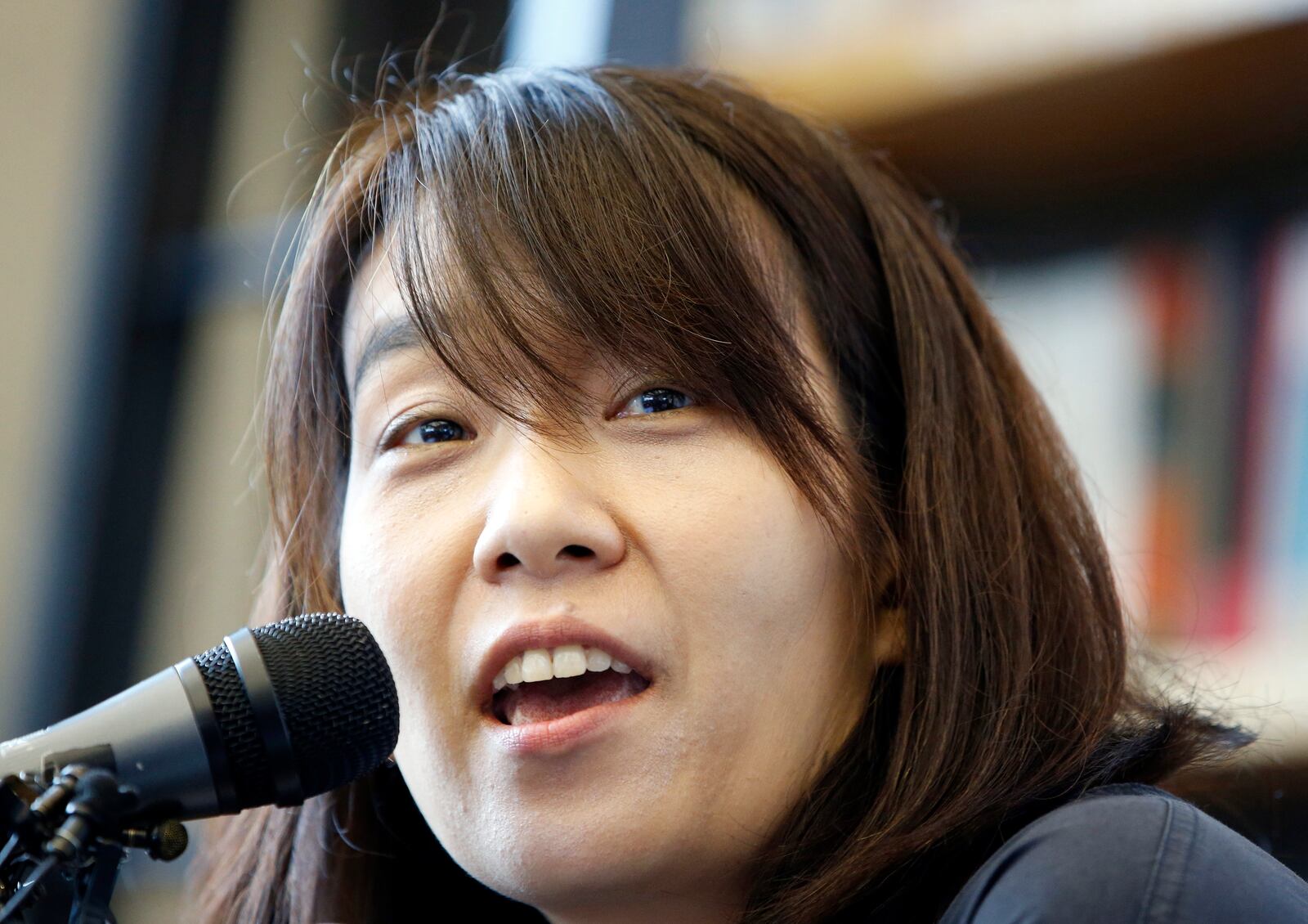 FILE - South Korean author Han Kang answers a reporter's question during a news conference in Seoul, South Korea, Tuesday, May 24, 2016, who has been awarded the Nobel Prize in literature. (AP Photo/Lee Jin-man, File)