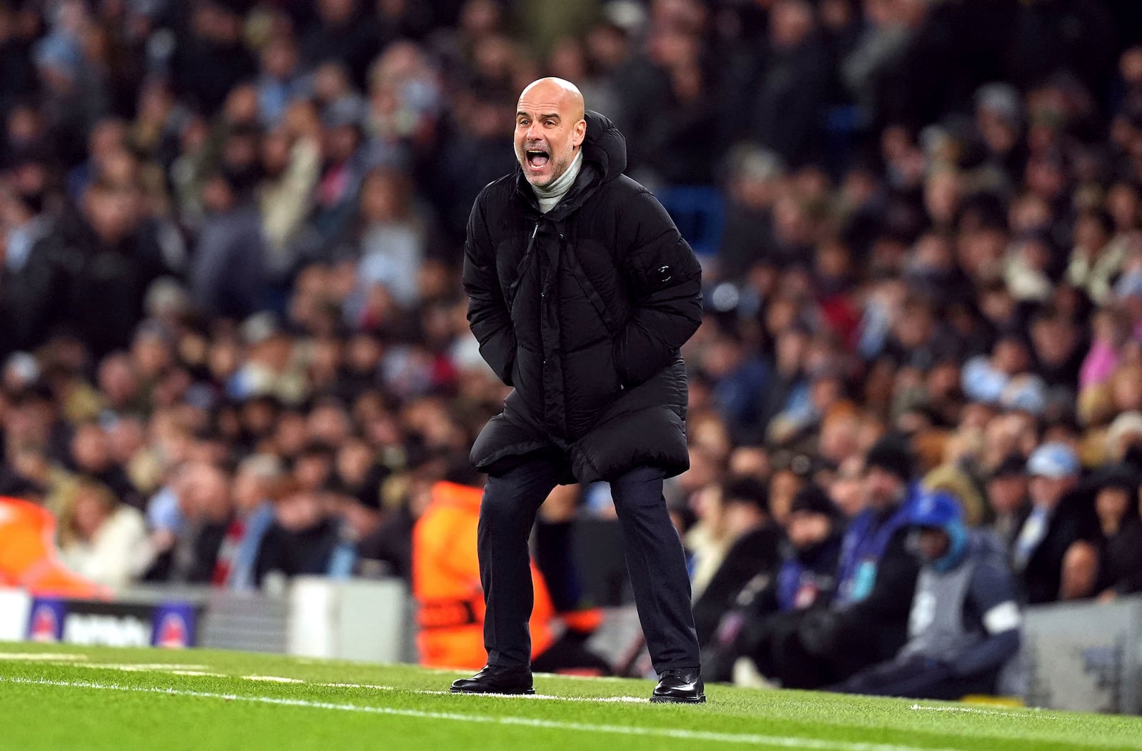 Manchester City manager Pep Guardiola reacts during the Champions League opening phase soccer match between Manchester City and Feyenoord at the Etihad Stadium in Manchester, England, Tuesday, Nov. 26, 2024. (Martin Rickett/PA via AP)