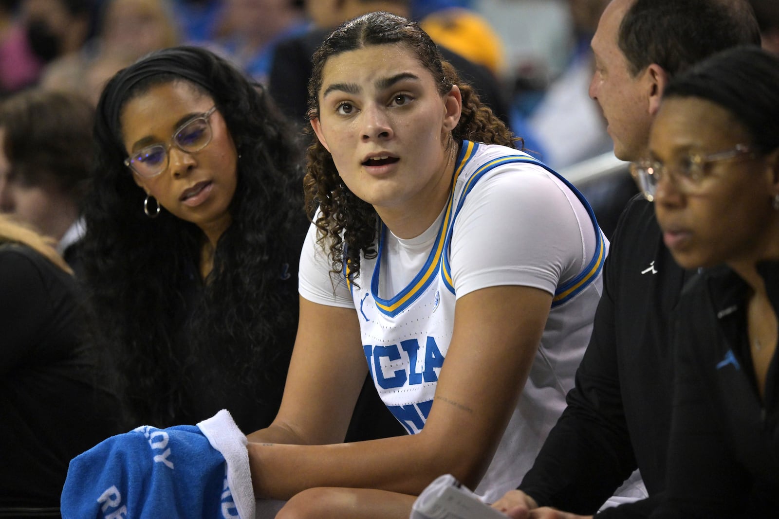 UCLA center Lauren Betts, center, looks on from the bench during the second half of an NCAA college basketball game against Minnesota, Sunday, Feb. 2, 2025, in Los Angeles. (AP Photo/Jayne Kamin-Oncea)