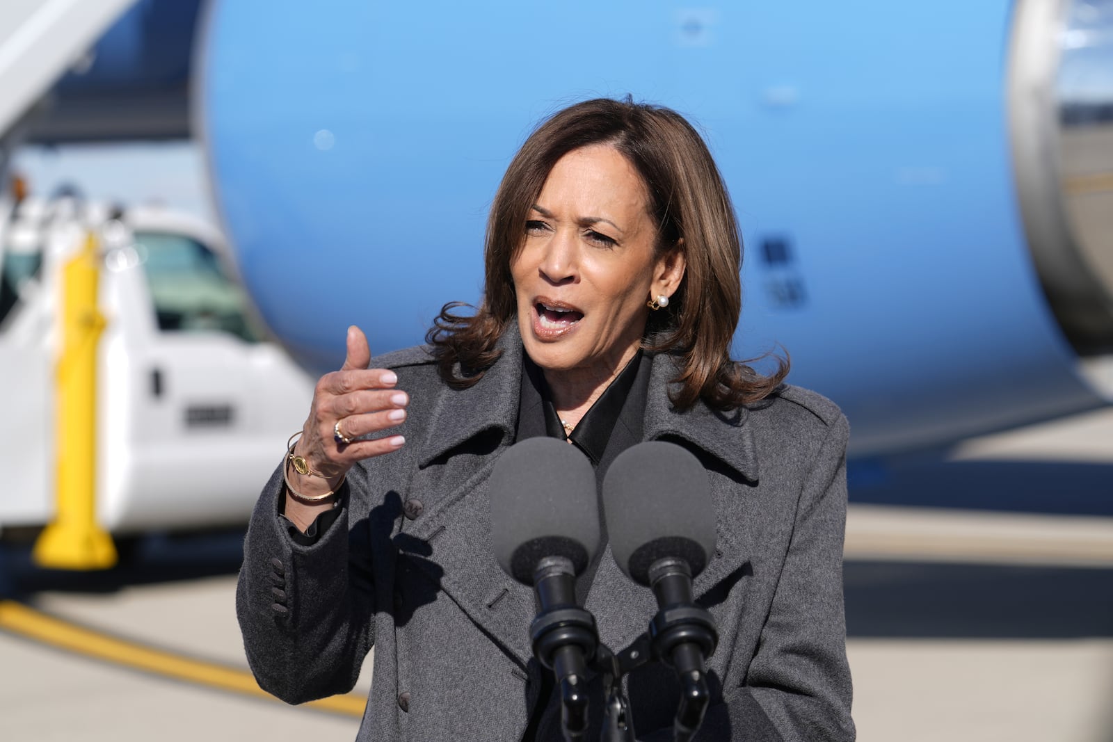 Democratic presidential nominee Vice President Kamala Harris speaks to the media after walking off Air Force Two in Madison, Wis., Friday, Nov. 1, 2024. (AP Photo/Charles Rex Arbogast)