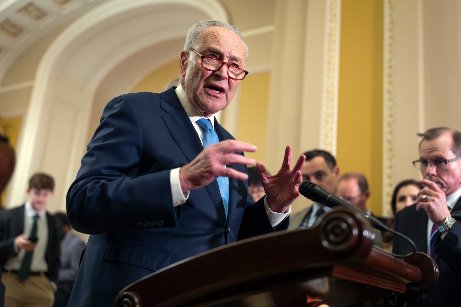 Senate Minority Leader Chuck Schumer, D-N.Y., speaks to reporters after a closed-door strategy meeting at the Capitol in Washington, Wednesday, Feb. 19, 2025. (AP Photo/J. Scott Applewhite)