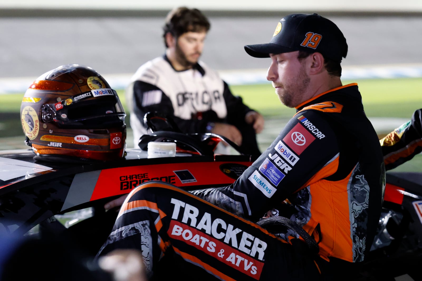 Chase Briscoe climbs in his car before the start of the first of two NASCAR Daytona 500 qualifying auto races at Daytona International Speedway, Thursday, Feb. 13, 2025, in Daytona Beach, Fla. (AP Photo/Terry Renna)