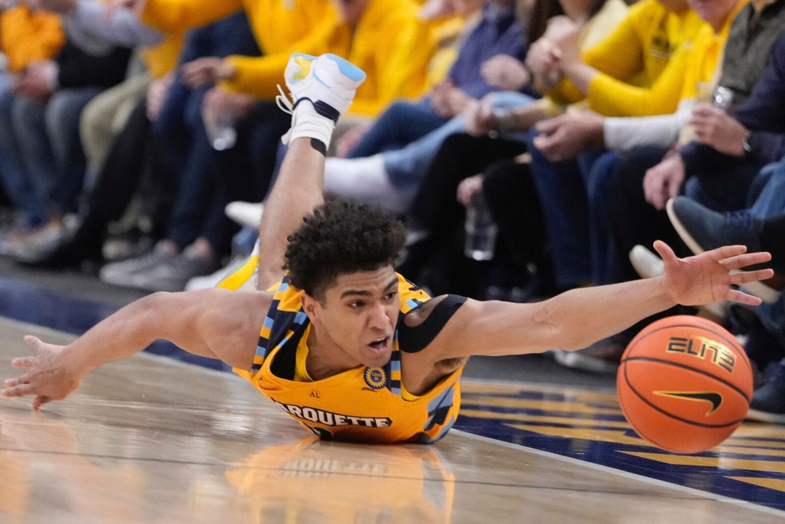 Marquette's Stevie Mitchell goes after a loose ball during the first half of an NCAA college basketball game Saturday, Feb. 1, 2025, in Milwaukee. (AP Photo/Morry Gash)