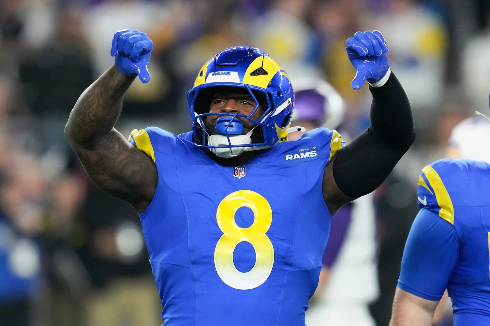 Los Angeles Rams linebacker Jared Verse (8) reacts to a sack on Minnesota Vikings quarterback Sam Darnold during the first half of an NFL wild card playoff football game, Monday, Jan. 13, 2025, in Glendale, Ariz. (AP Photo/Ross D. Franklin)