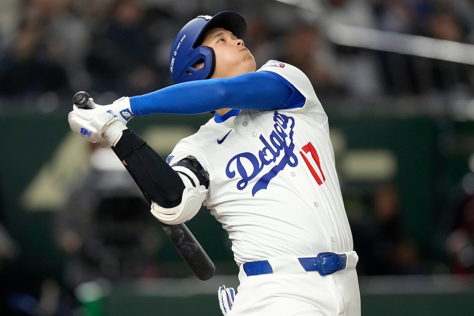 Los Angeles Dodgers' Shohei Ohtani flies out against the Hanshin Tigers during the third inning in an MLB Japan Series exhibition baseball game, Sunday, March 16, 2025, in Tokyo. (AP Photo/Hiro Komae)