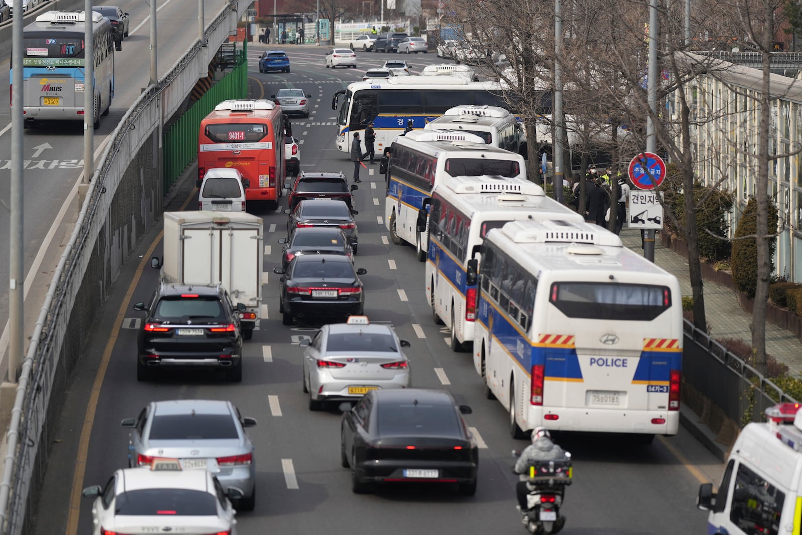 Police buses gather near the presidential residence in Seoul, South Korea, Friday, March 7, 2025. (AP Photo/Lee Jin-man)