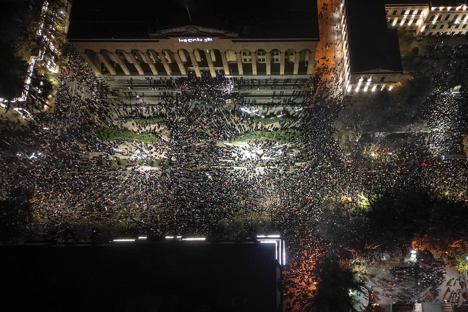 FILE - Demonstrators rally outside the parliament's building to protest the government's decision to suspend negotiations on joining the European Union in Tbilisi, Georgia, on Nov. 29, 2024. (AP Photo/Zurab Tsertsvadze, File)