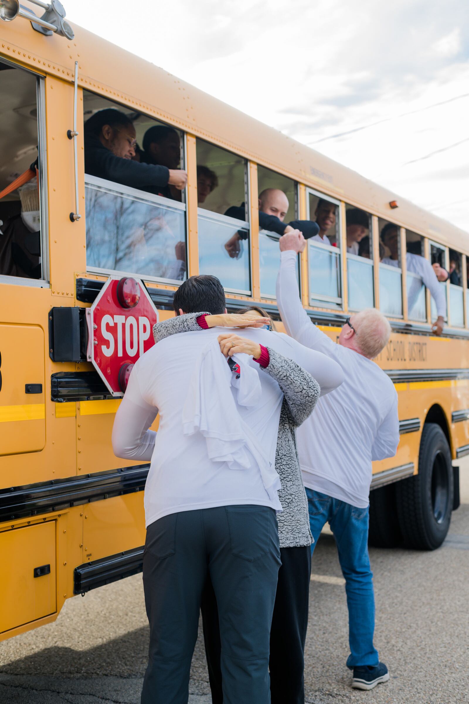 Sharon Revel and her family visited with the Fairfield High School boys basketball team players when their bus rolled by her home for a surprise visit last weekend ahead of a game they were playing in Dayton. CONTRIBUTED