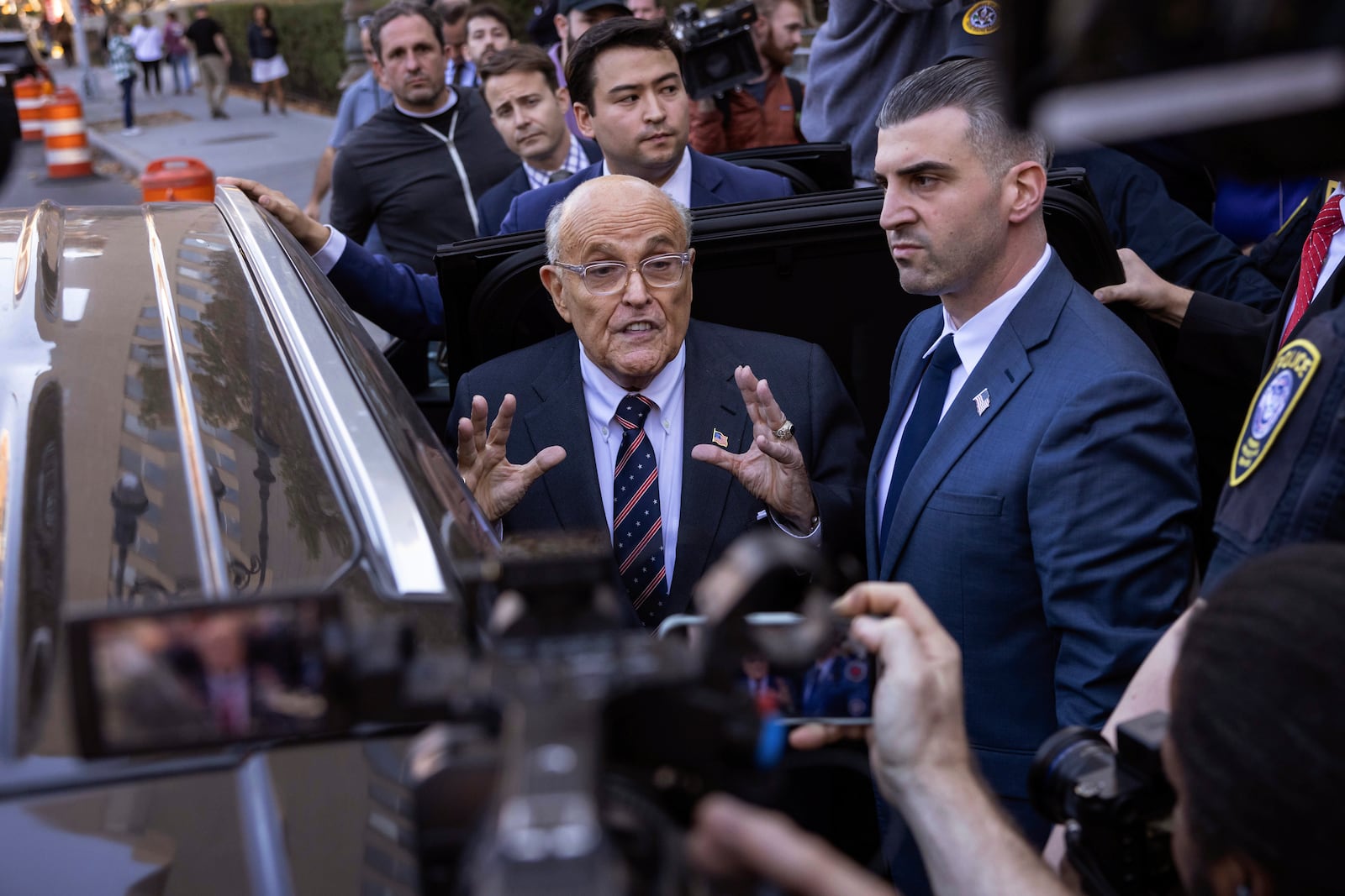 Former New York City Mayor Rudy Giuliani speaks to the members of the media as he leaves court in New York, Thursday, Nov. 7, 2024. (AP Photo/Yuki Iwamura)