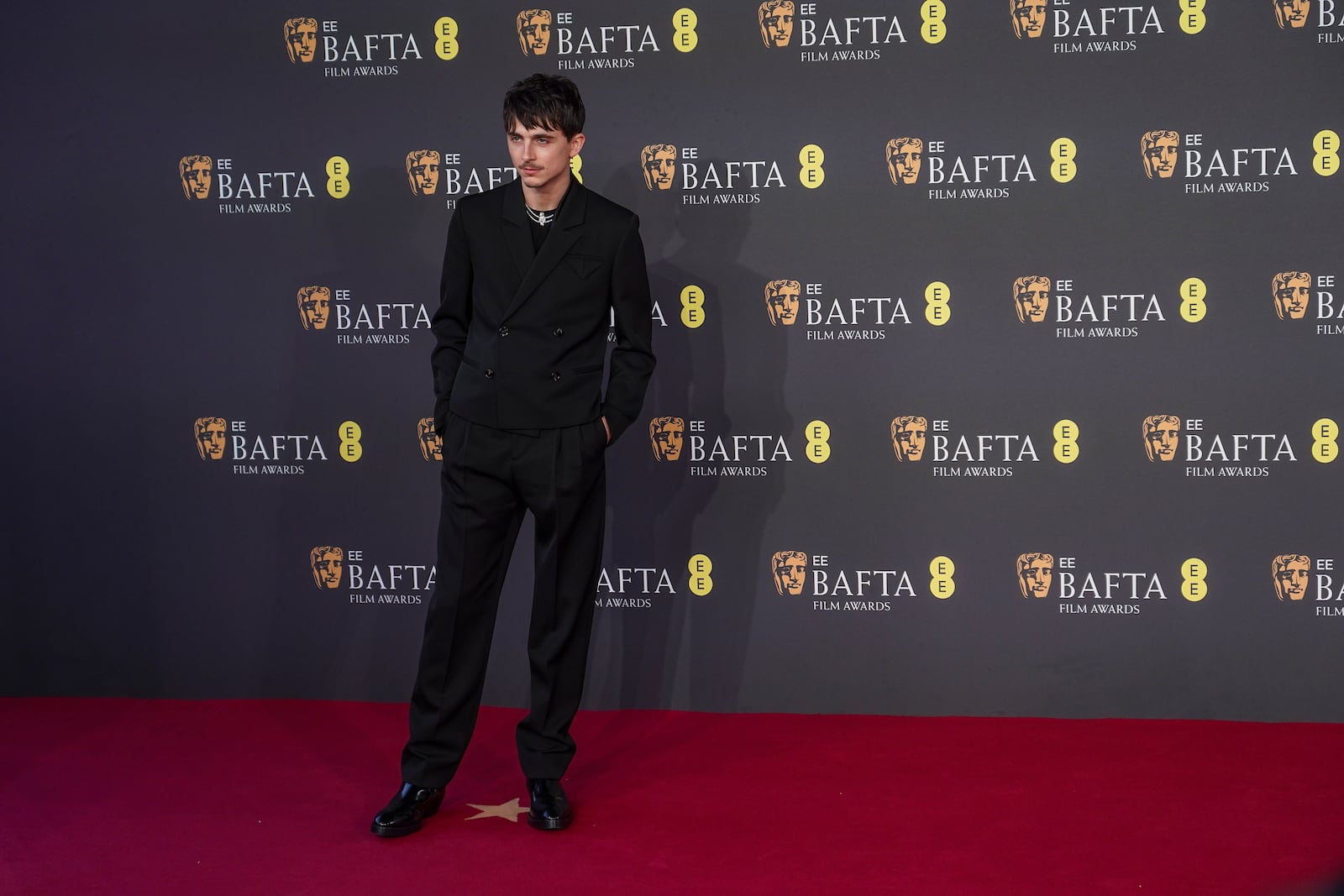 Timothee Chalamet poses for photographers upon arrival at the 78th British Academy Film Awards, BAFTA's, in London, Sunday, Feb. 16, 2025. (Photo by Alberto Pezzali/Invision/AP)