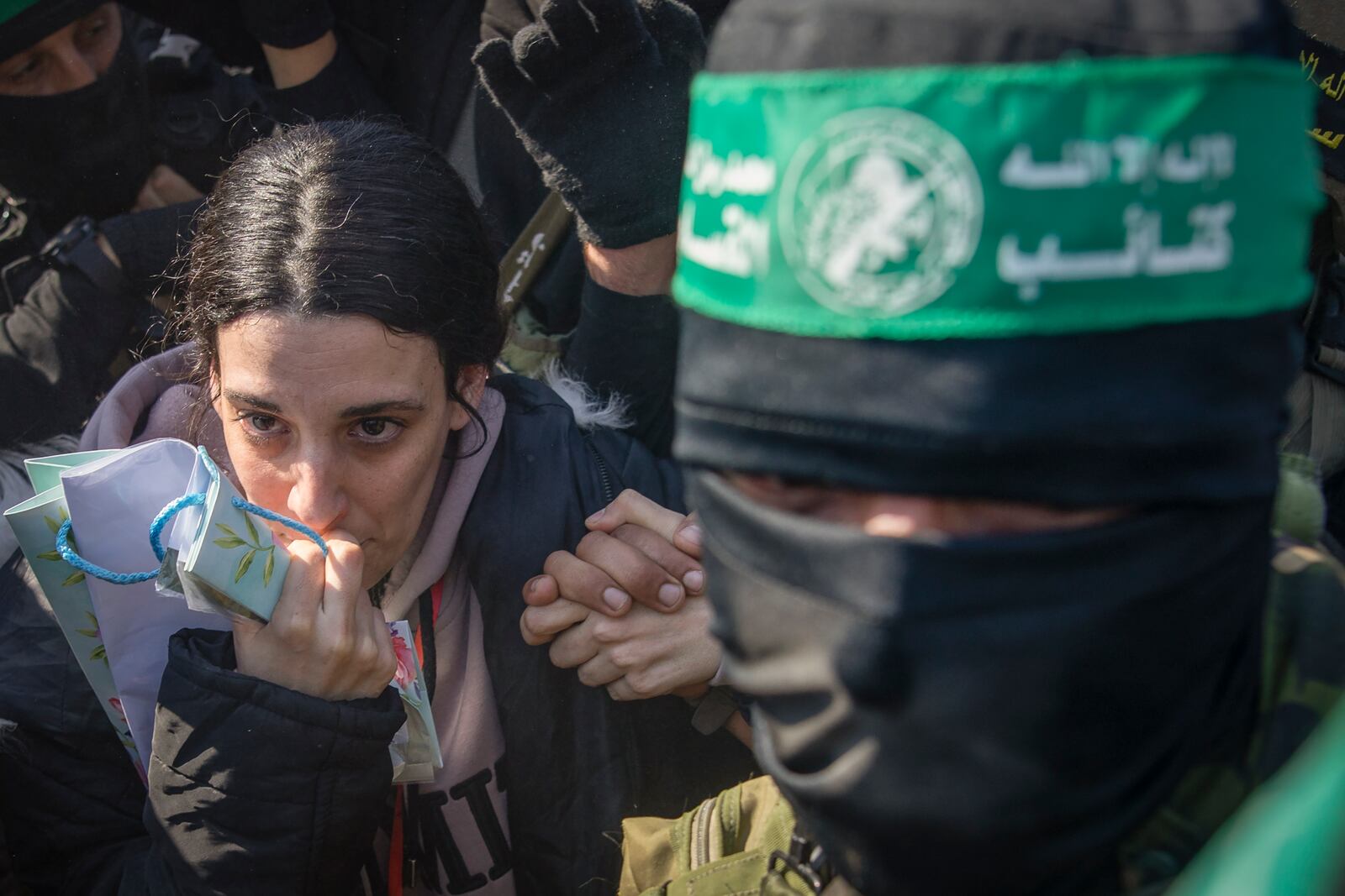 Israeli captive Arbel Yehoud, 29, who has been held hostage by Hamas in Gaza since October 7, 2023, is escorted by Hamas and Islamic Jihad fighters as she is handed over to the Red Cross in Khan Younis, southern Gaza Strip, Thursday Jan. 30, 2025.(AP Photo/Jehad Alshrafi)