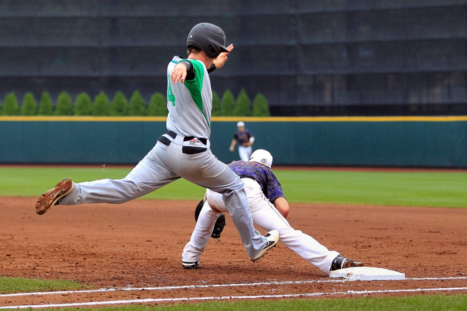 Badin’s Alex Holderbach strides toward first base during a Division III state semifinal against Bloom-Carroll on June 6, 2013, at Huntington Park in Columbus. Bloom-Carroll won 3-2. COX MEDIA FILE PHOTO