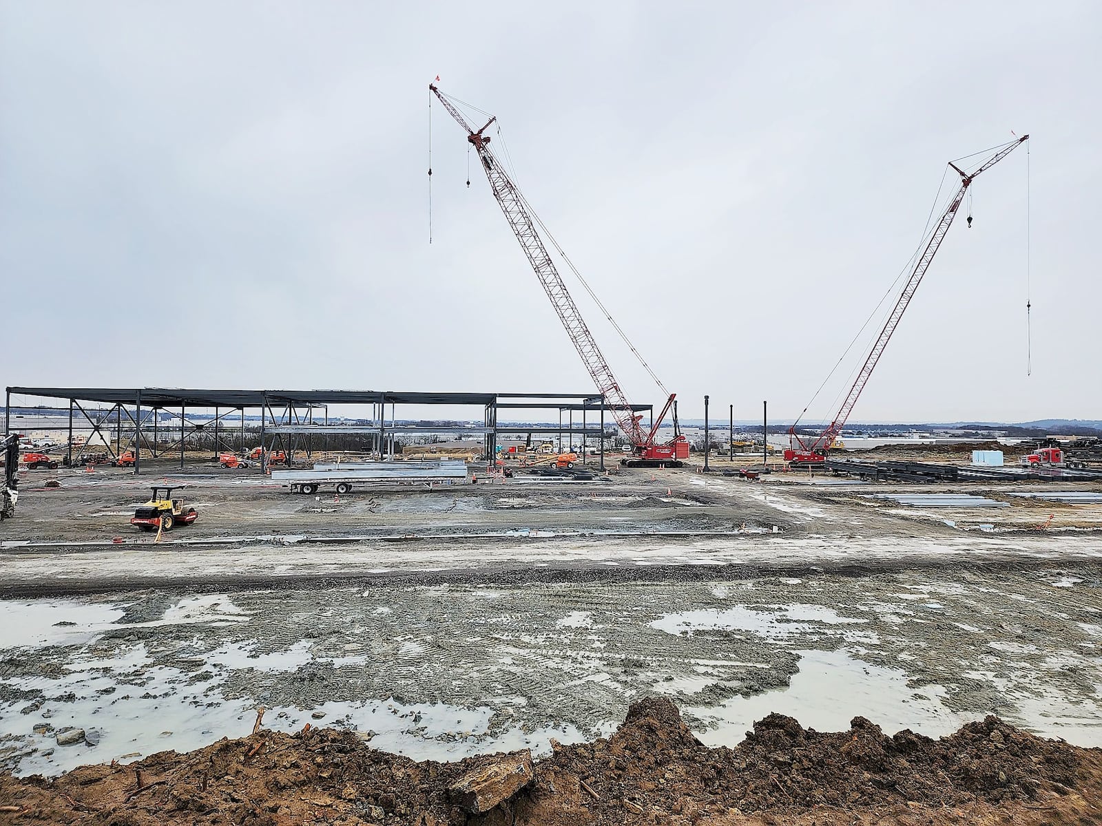 Construction continues as Koch Foods adds a $200 million-plus investment into an expansion of its operations. The company is building a new structure on an 18-acre site adjacent to its current facility on Port Union Road. NICK GRAHAM/STAFF