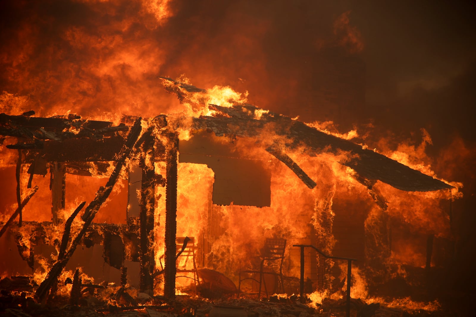 Flames engulf a structure during the Mountain Fire, Wednesday, Nov. 6, 2024, near Camarillo, Calif. (AP Photo/Ethan Swope)