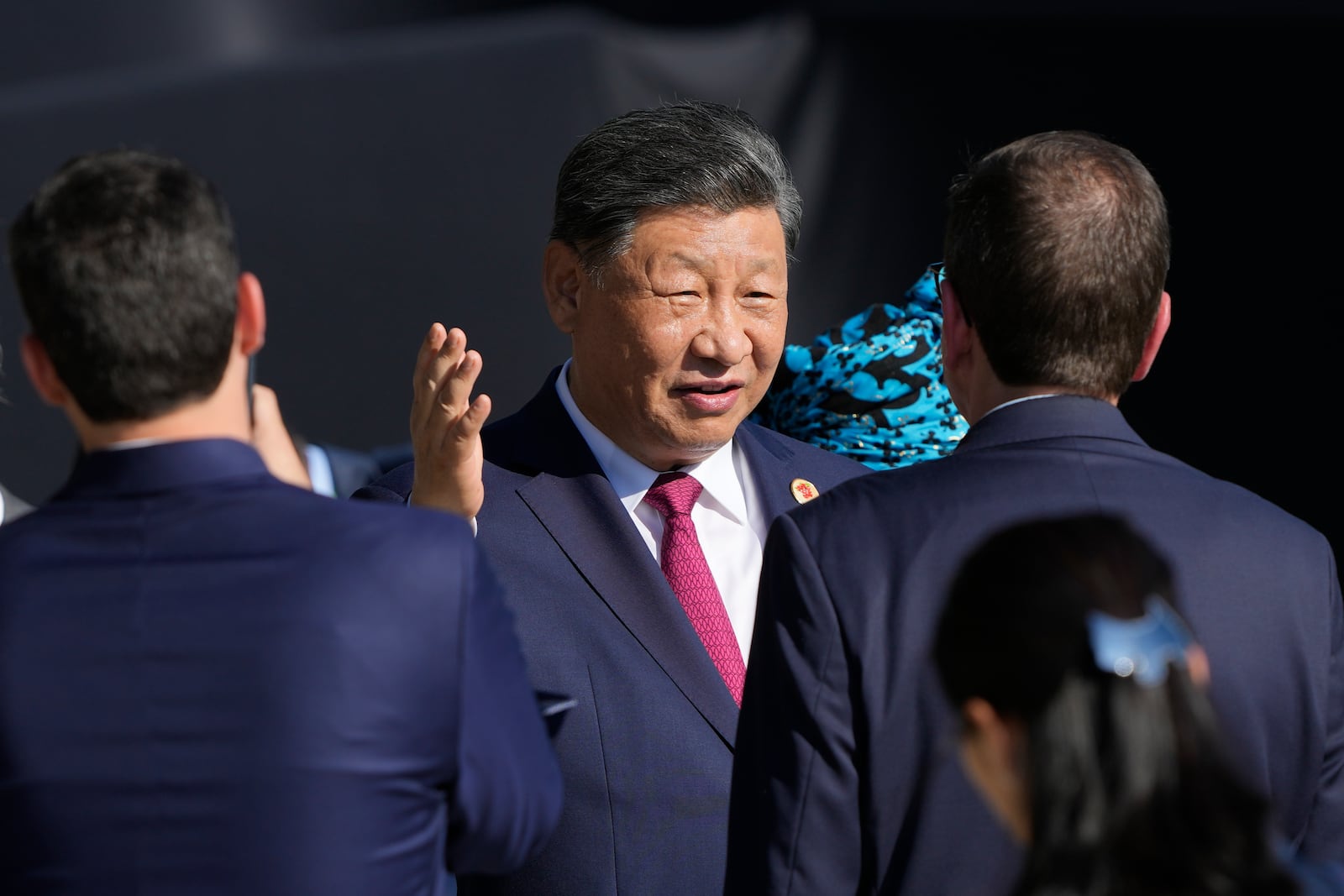 China's President Xi Jinping talks after joining a group photo during the G20 Summit in Rio de Janeiro, Monday, Nov. 18, 2024. (AP Photo/Eraldo Peres)