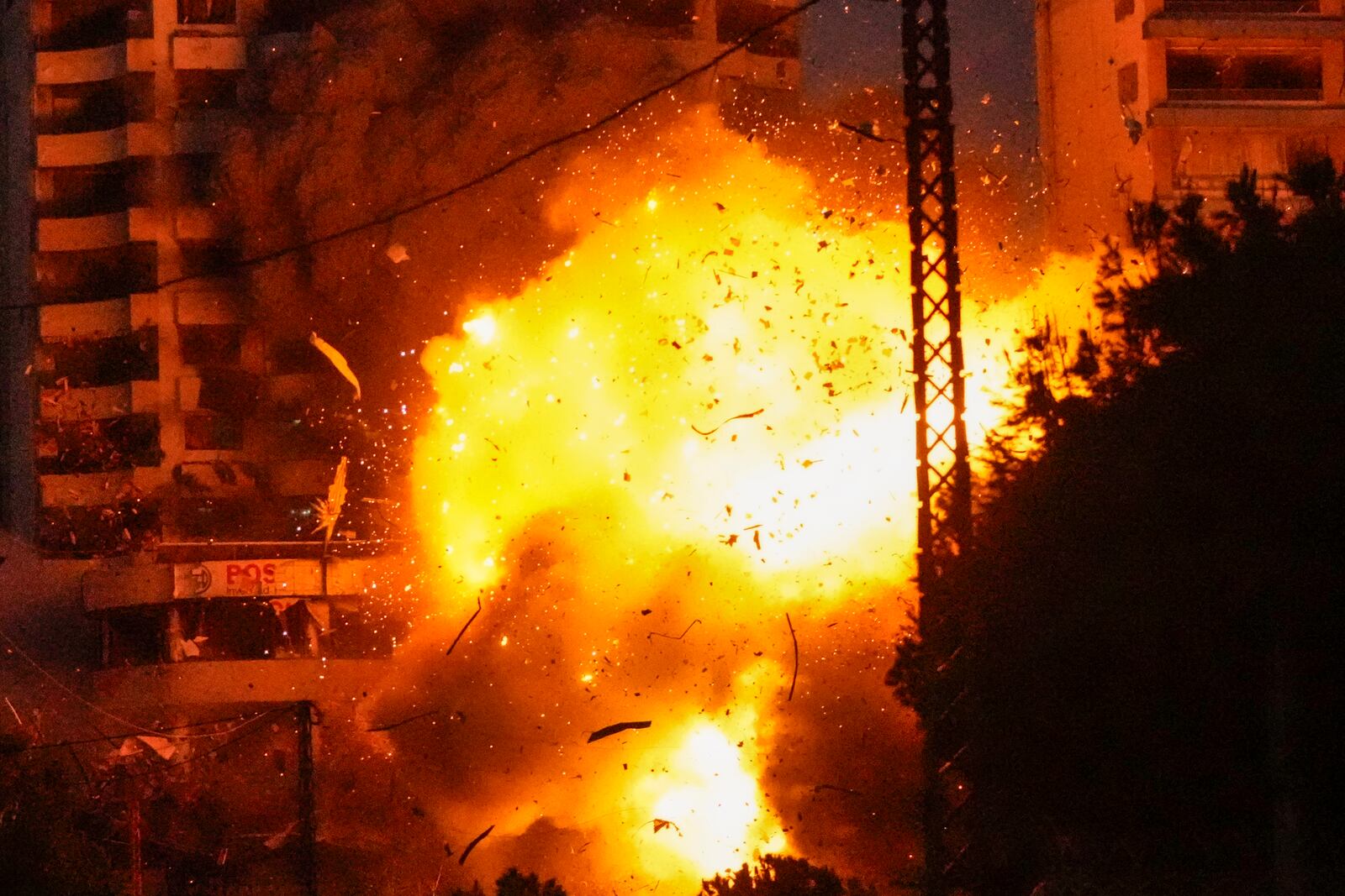 Thick smoke and flames erupt from an Israeli airstrike on Tayouneh, Beirut, Lebanon, Monday, Nov. 25, 2024. (AP Photo/Hassan Ammar)