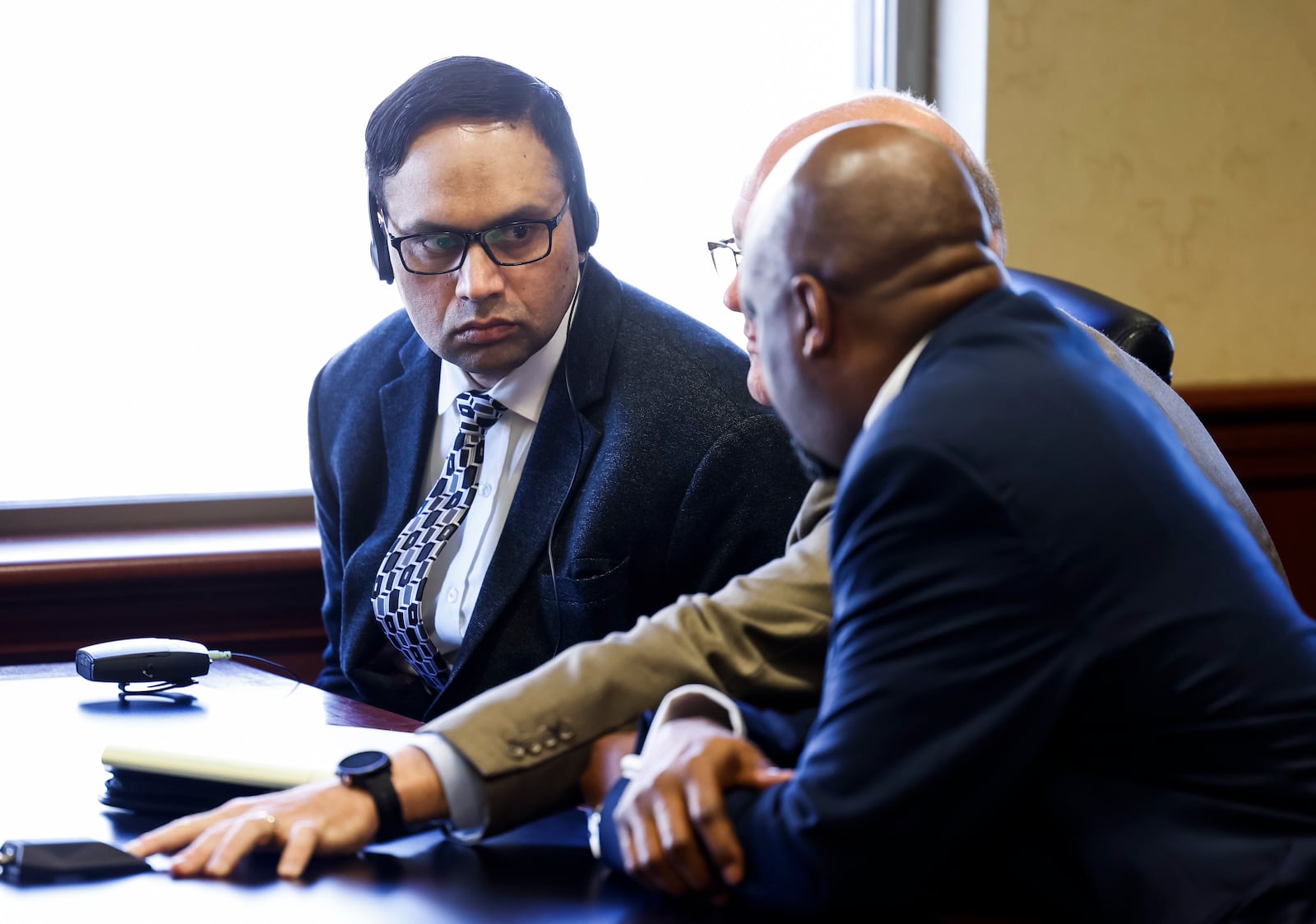 Gurpreet Singh, left, accused of a quadruple homicide in 2019, sits with his new attorneys Jeremy Evans, middle, and David Washington, right, during a pretrial hearing in Butler County Common Pleas Court Wednesday, Nov. 9, 2022 in Hamilton. Singh's first trial was held last month but the jury was unable to reach a verdict. A new pretrial date is scheduled for Jan. 11, 2023. NICK GRAHAM/STAFF NICK GRAHAM/STAFF