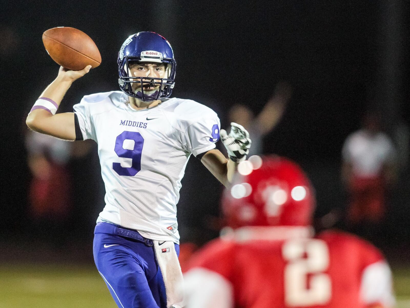 Middletown quarterback Zach Maloney throws the ball as Fairfield’s Kyle Schimpf defends during their game at Fairfield Stadium on Sept. 16, 2016. The host Indians won 42-0. NICK GRAHAM/STAFF