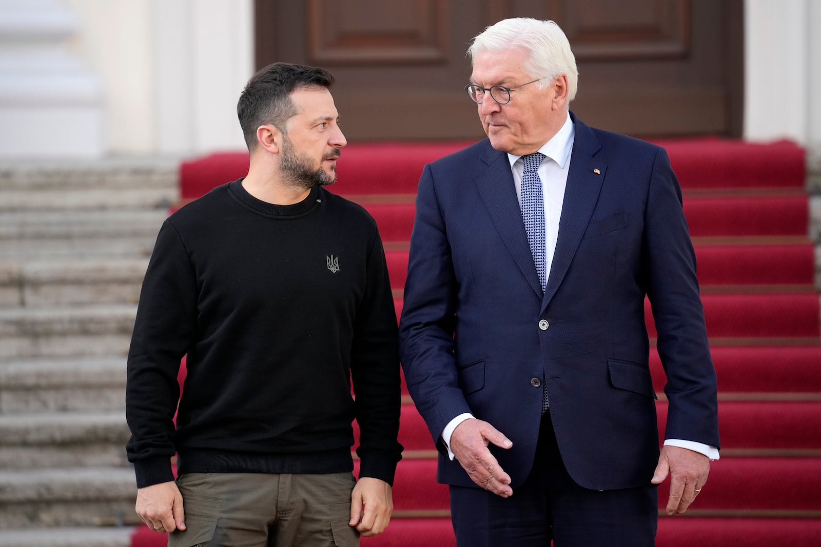 Ukraine's president Volodymyr Zelenskyy is welcomed by German president Frank-Walter Steinmeier at Schloss Bellevue in Berlin, Germany, Friday, Oct. 11, 2024. (AP Photo/Ebrahim Noroozi)