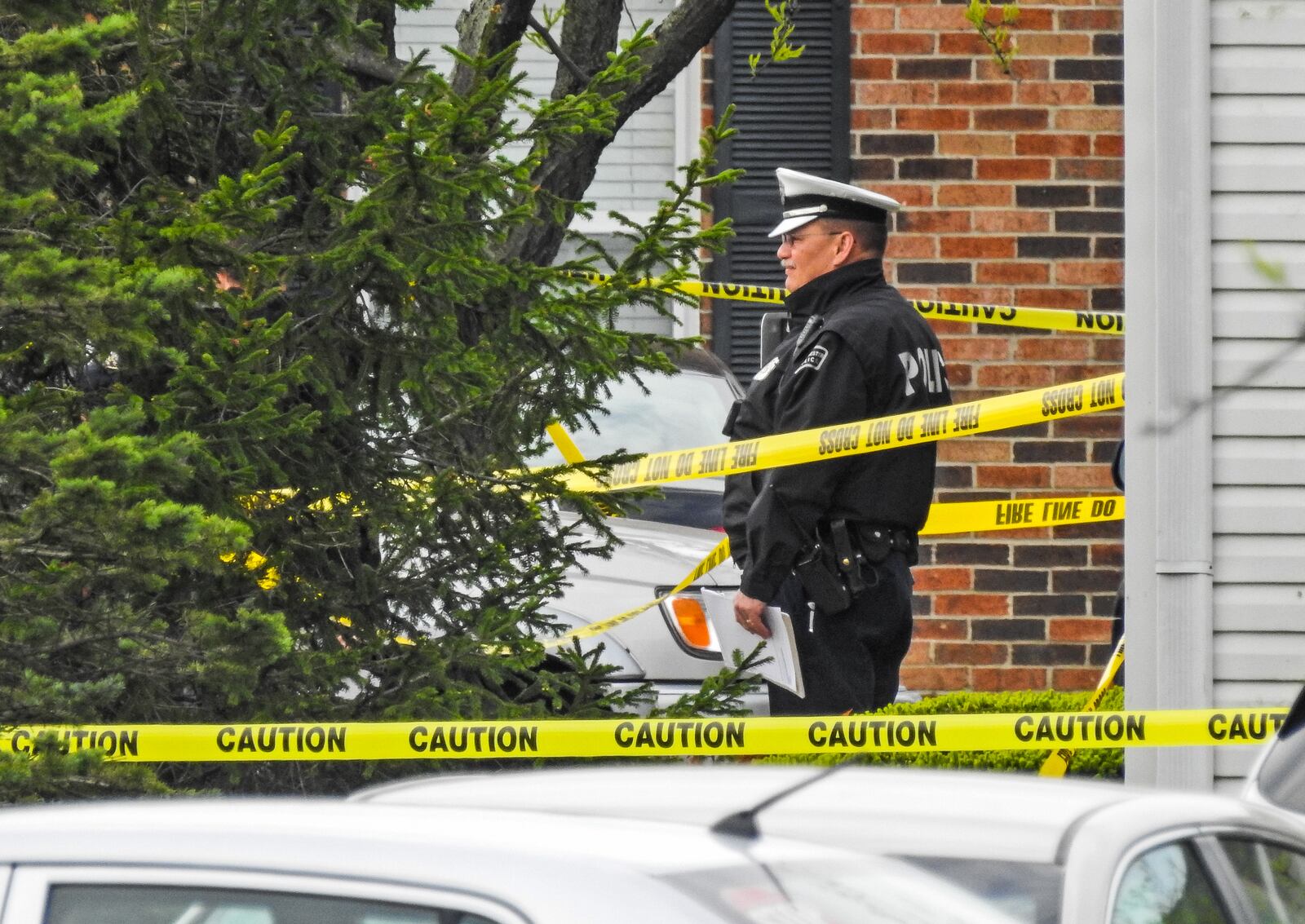 West Chester Police investigate at the scene where four people were found dead with apparent gunshot wounds inside an apartment at Lakefront at West Chester apartment complex on Wyndtree Drive in West Chester Township Monday, April 29, 2019. NICK GRAHAM/STAFF