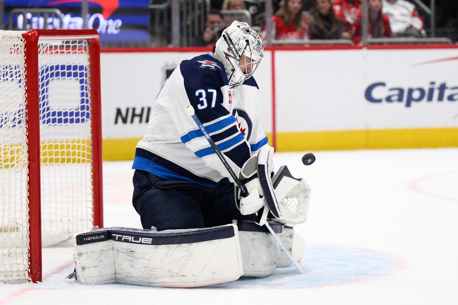 Winnipeg Jets goaltender Connor Hellebuyck stops the puck during the first period of an NHL hockey game against the Washington Capitals, Saturday, Feb. 1, 2025, in Washington. (AP Photo/Nick Wass)