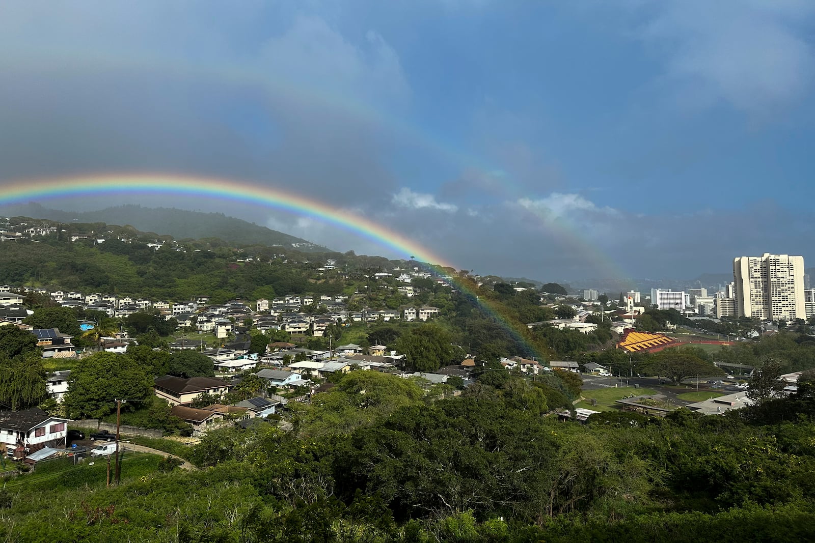 Two rainbows are seen in the sky on April 24, 2024, in Honolulu. (AP Photo/Audrey McAvoy)