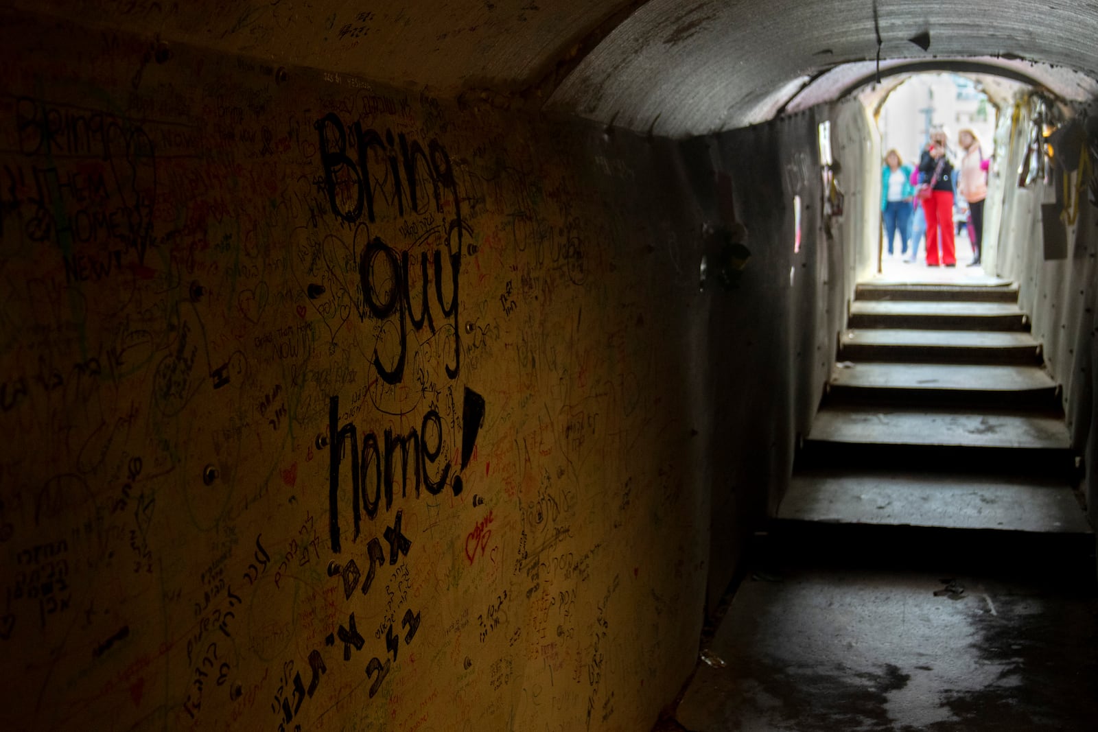 A replica of a tunnel used by Hamas militants, seen from inside as as people gather for a rally to free the hostages held in the Gaza Strip, in Tel Aviv, Israel, Tuesday, Jan. 14, 2025. (AP Photo/Maya Alleruzzo)