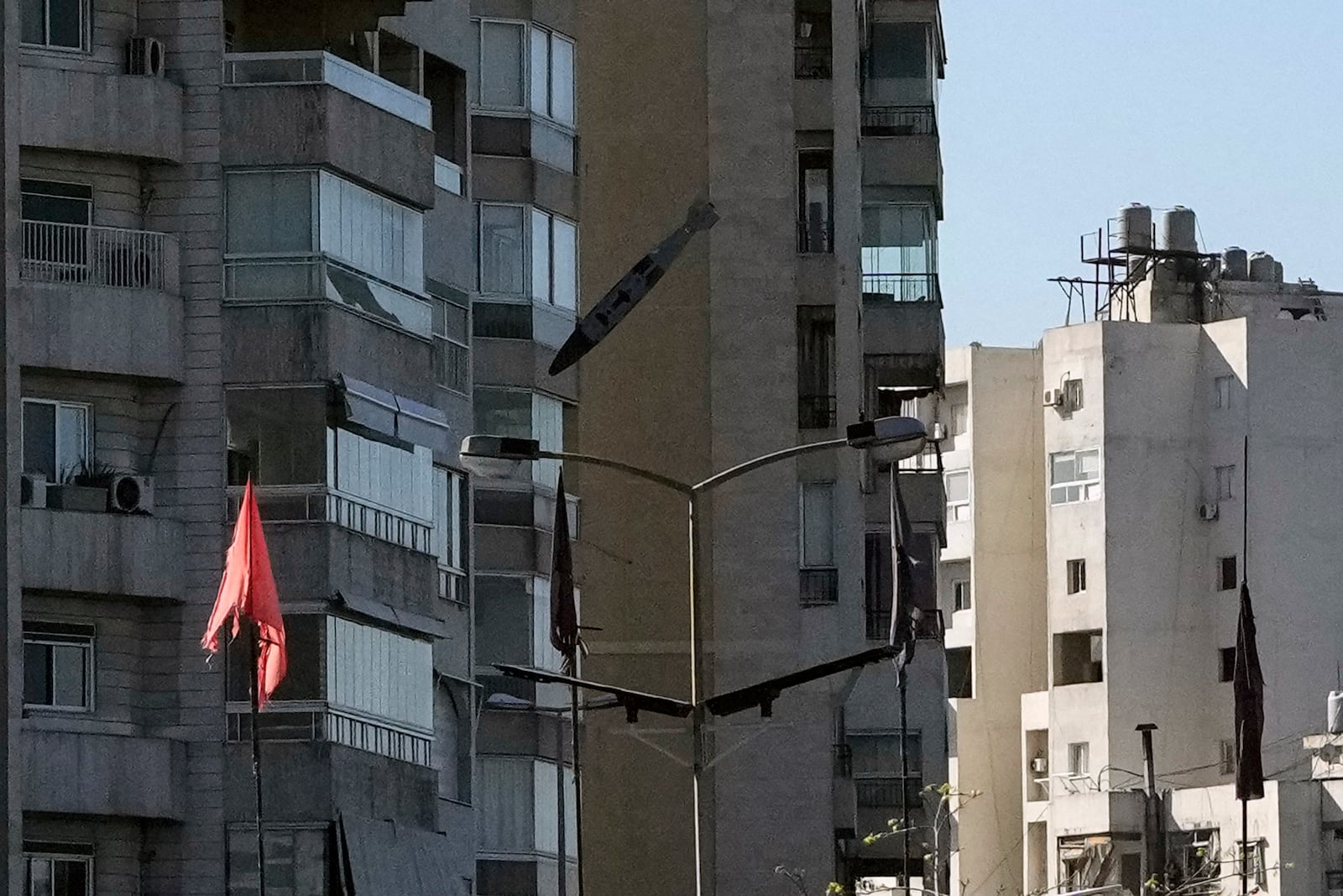 A bomb dropped from an Israeli jet hits a building in Tayouneh, Beirut, Lebanon, Friday, Nov. 15, 2024. (AP Photo/Hassan Ammar)