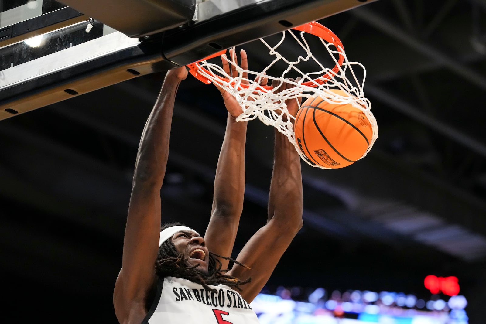 San Diego State forward Pharaoh Compton dunks during the first half of a First Four college basketball game against North Carolina in the NCAA Tournament, Tuesday, March 18, 2025, in Dayton, Ohio. (AP Photo/Jeff Dean)