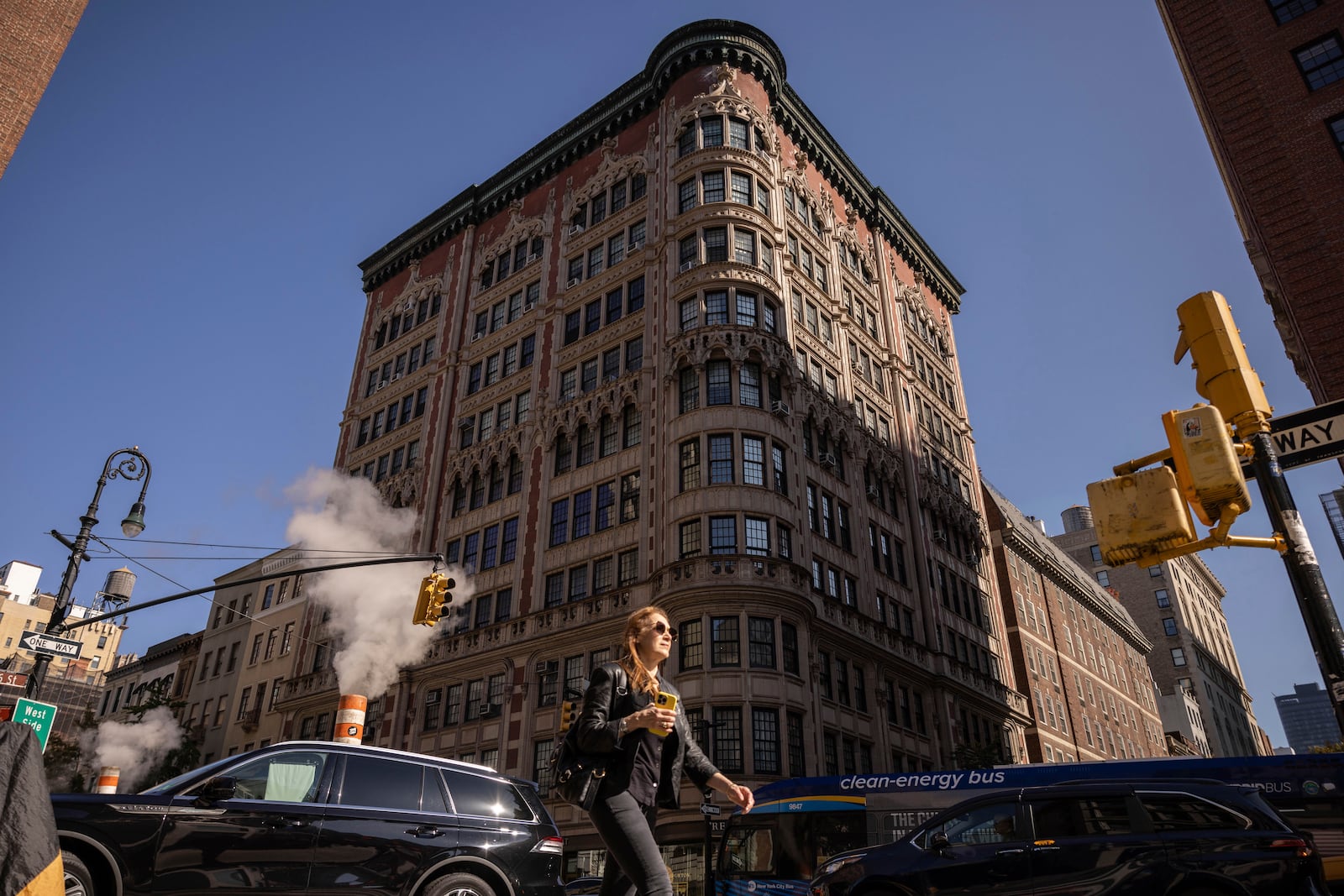 A person walks past the 45 East 66th Street, a building that includes an apartment owned by former New York City Mayor Rudy Giuliani, Wednesday, Oct. 23, 2024, in New York. (AP Photo/Yuki Iwamura)