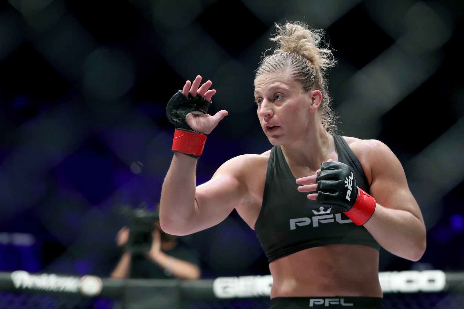 FILE - Kayla Harrison is shown during a PFL (Professional Fighters League) bout against Larissa Pacheco at Nassau Coliseum in Uniondale, N.Y., in this Thursday, May 9, 2019, file photo. Two-time Olympic gold medalist Kayla Harrison tries for another $1 million prize when she fights  Taylor Guardado in the main event of the 2021 PFL Championships this week in Florida. (AP Photo/Greg Payan, File)