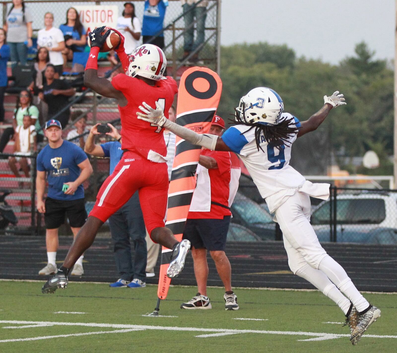 Dillon Lee of Fairfield makes in interception in front of Gabe Ramirez. Fairfield defeated visiting Hamilton 34-27 in a Week 4 high school football game on Friday, Sept. 20, 2019. MARC PENDLETON / STAFF