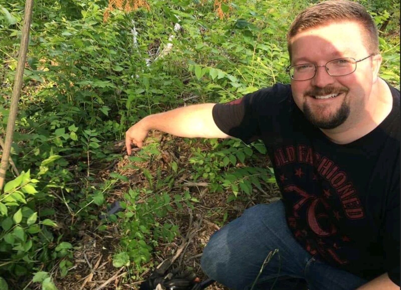 Jared Shank, a member of the Dayton Diggers, points to the location on a rural road near Miamisburg where he was using a metal detector to find a cell phone that was key evidence in a Lebanon homicide investigation SUBMITTED