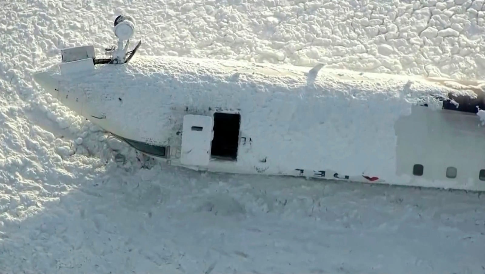 This image taken from video provided by CTV shows an aerial view of the overturned plane at Toronto Pearson Airport, Tuesday, Feb. 18, 2025. (CTV via AP)