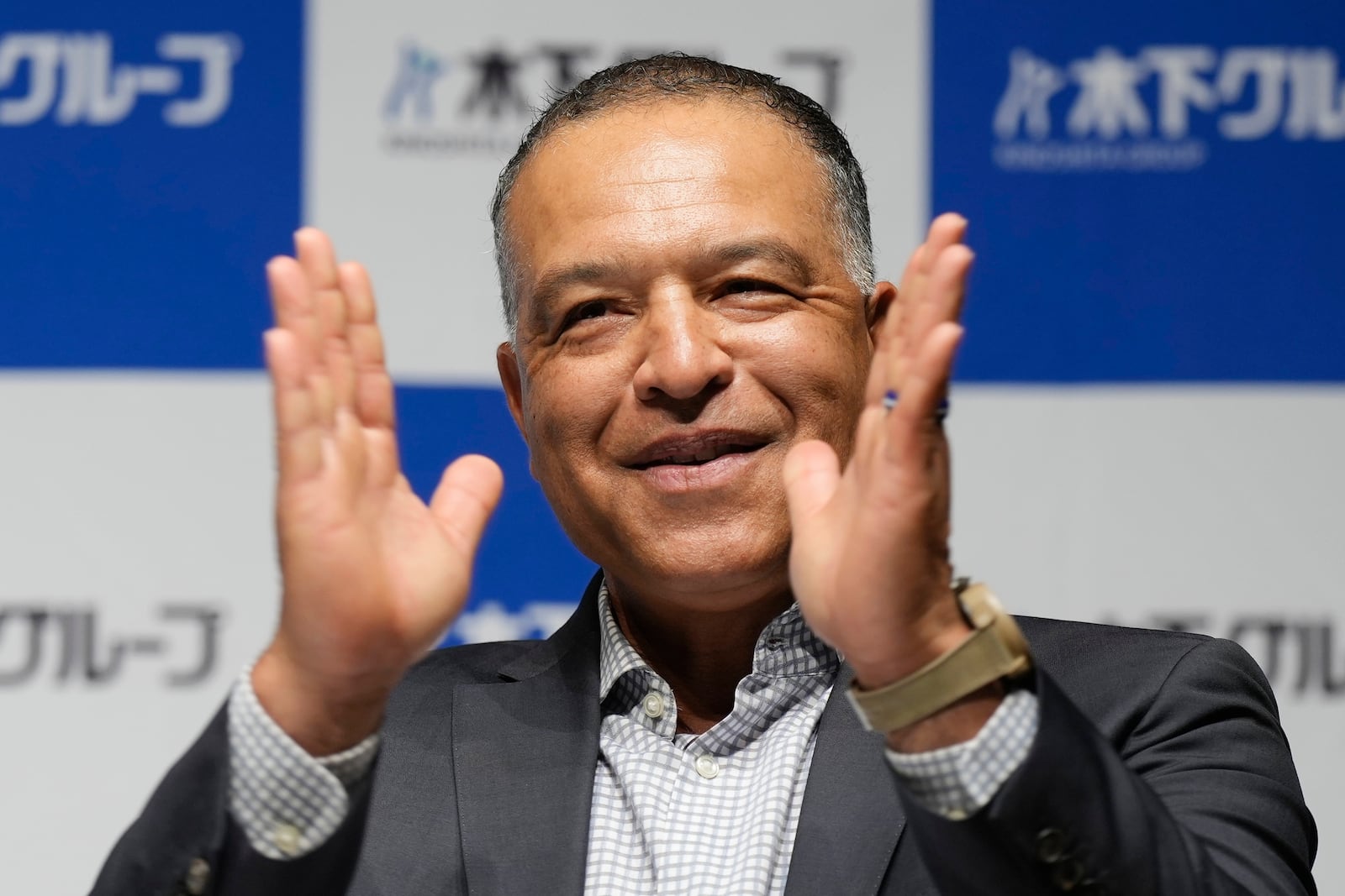 Los Angeles Dodgers manager Dave Roberts attends a press conference on the commercials he appears Wednesday, Dec. 4, 2024, in Tokyo. (AP Photo/Eugene Hoshiko)