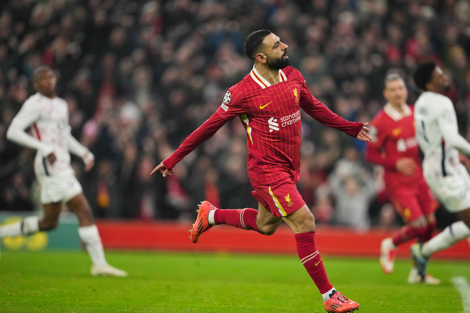 Liverpool's Mohamed Salah celebrates after scoring his side's first goal during the Champions League, opening phase soccer match between Liverpool and Lille at Anfield Stadium, Liverpool, England, Tuesday, Jan.21, 2025. (AP Photo/Jon Super)