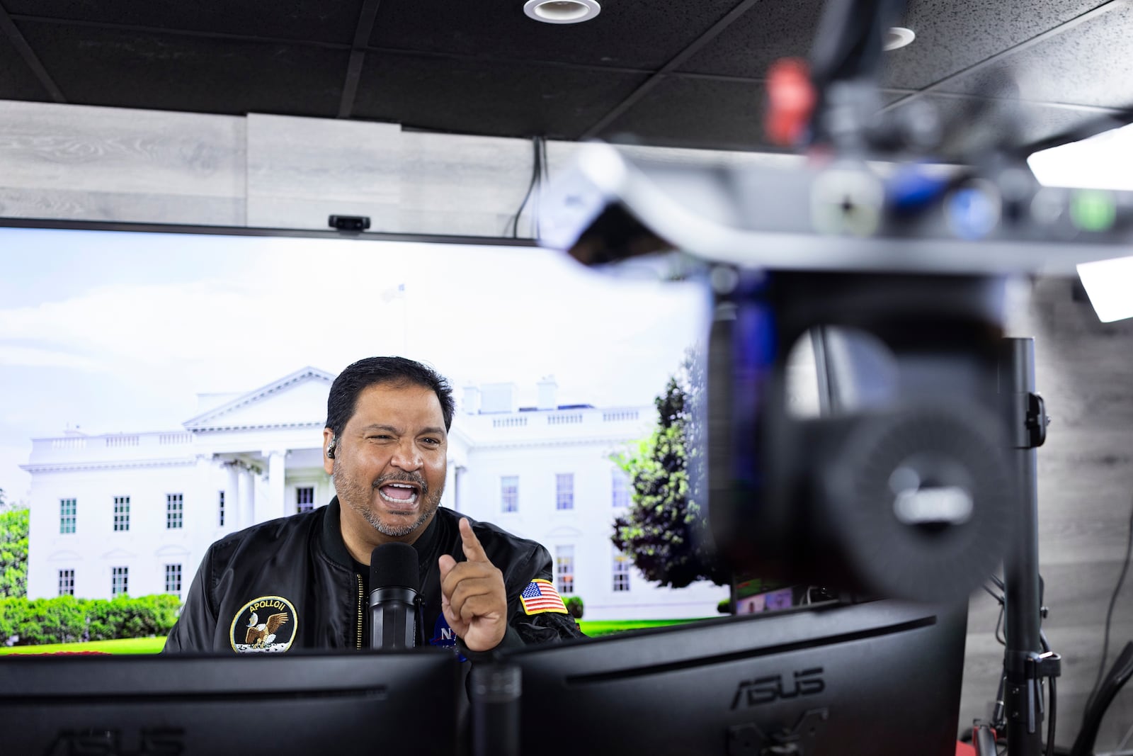 Radio host and owner of radio station La Mega 101.7 FM Victor Martinez speaks on the air in Allentown, Pa., Tuesday, Oct. 15, 2024. (AP Photo/Ryan Collerd)