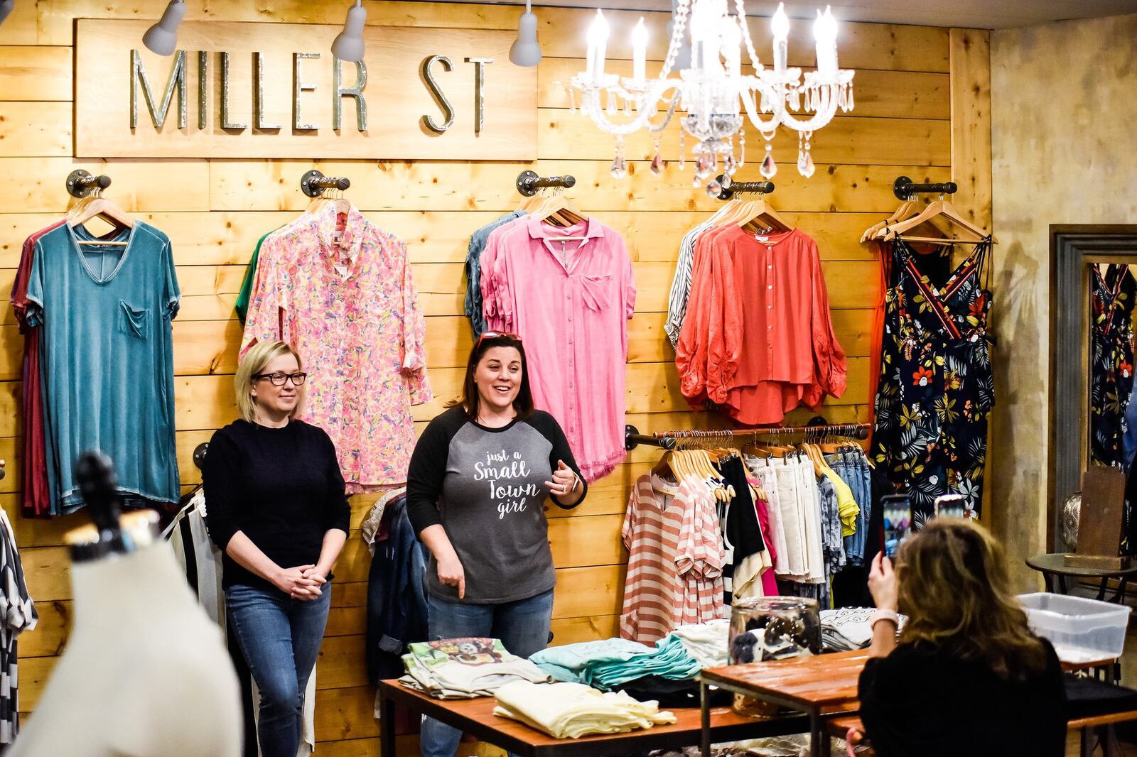 Tara Smithson, left, and Stephanie Gonya, co-owners of Miller St. Boutique on Nilles Road in Farifield, go live on Facebook and Instagram Monday, May 11, 2020 to talk about opening their retail shop to customers on Tuesday. They have increased their online presence since they have been closed almost two months due to the coronavirus pandemic. NICK GRAHAM / STAFF